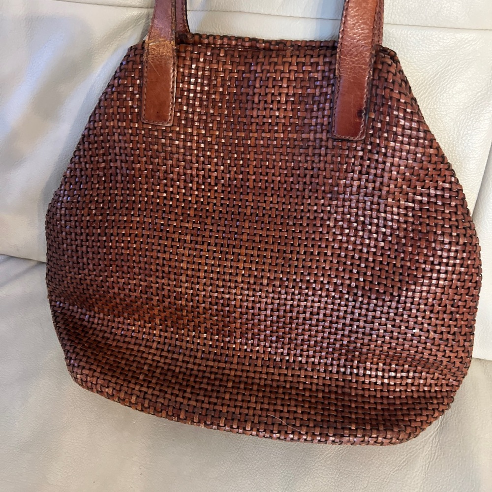 Americana by Sharif Brown Leather, handle is damage, see photos.